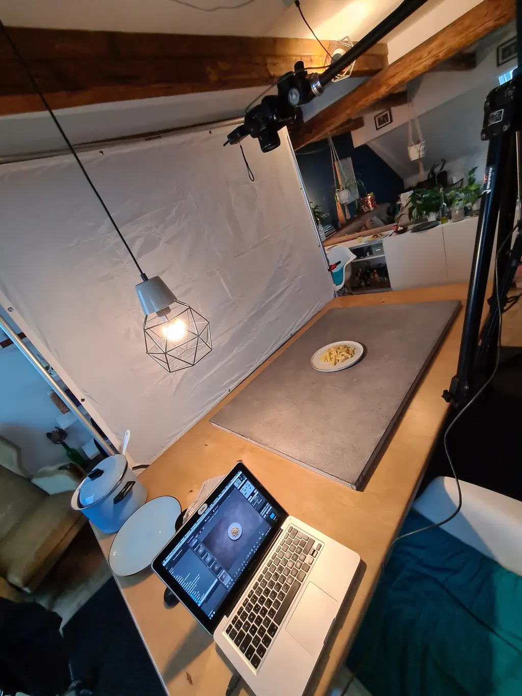 Camera above the pasta plate, lighting setup and laptop used to review the food photographs
