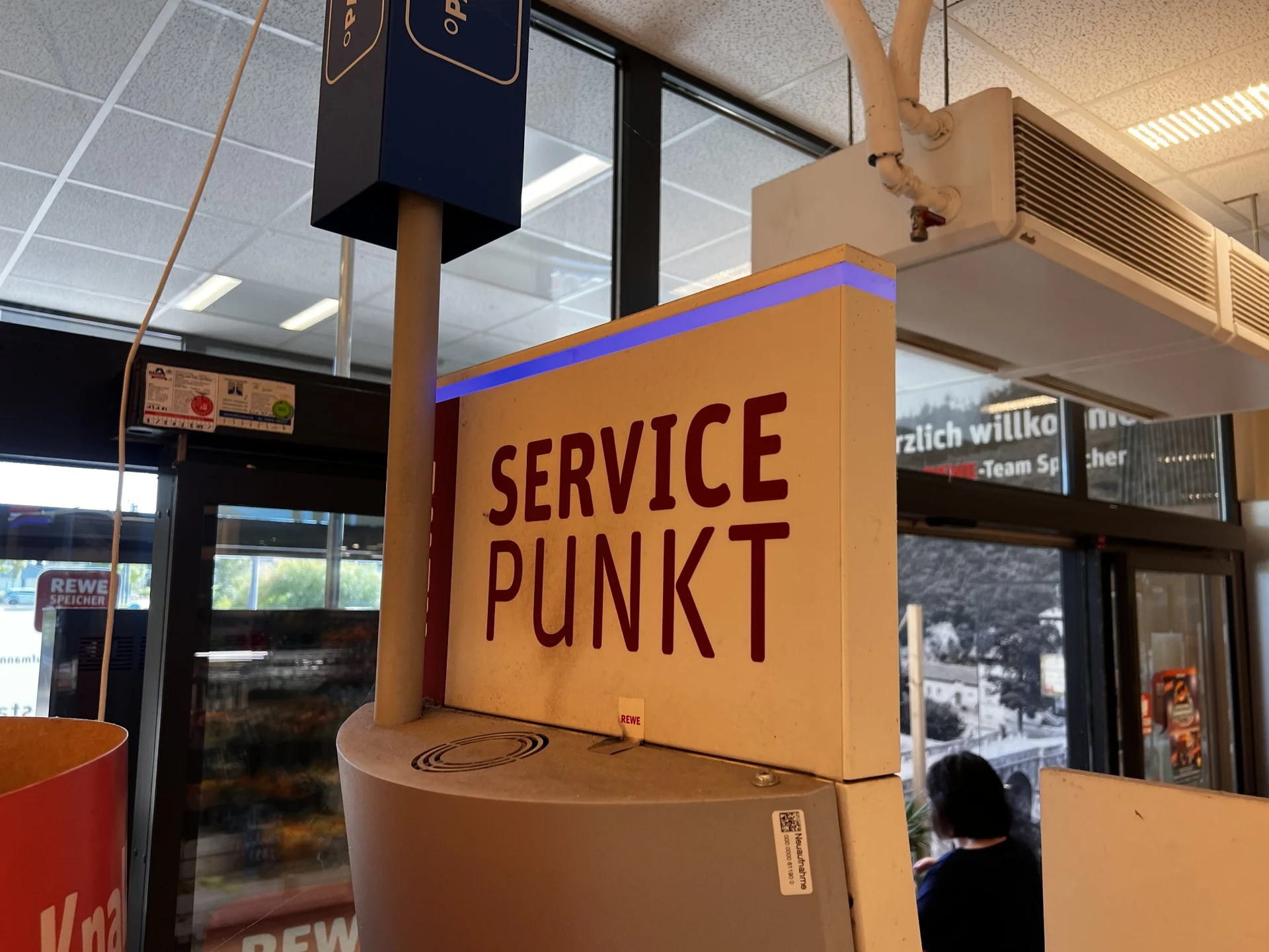 Reference photographs of the REWE service point, documenting its appearance and dimensions for the 3D model — 3
